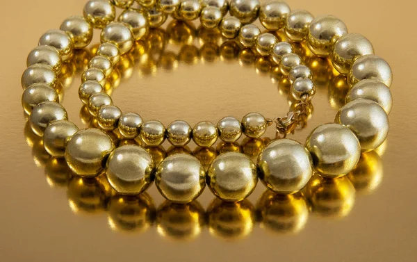 Large Beads Necklace on Gold — Stock Photo, Image