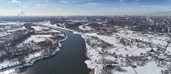 Aerial view of Moscow river near kolomenskoe and pechatniki district. Aerial view from drone to winter snow river.