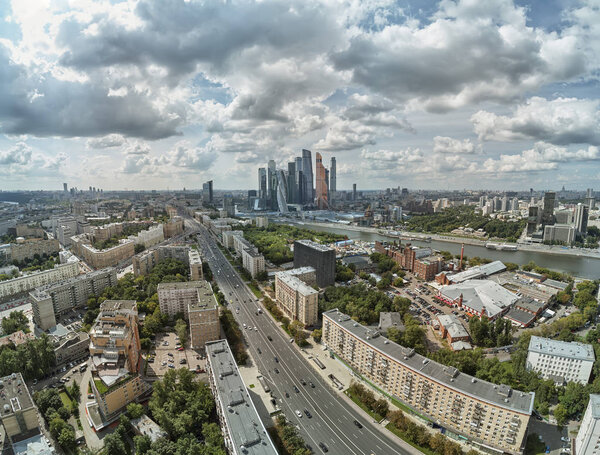 Landscape of Moscow architecture combining modern and old city, Russia. Outdoor modern Moscow city skyscrapers. Travel Russia and explore architecture landmarks of Moscow business center. Urban Moscow