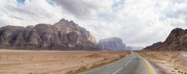 Panoramic View of Empty Desert Road in Wadi Rum Desert, Jordan.