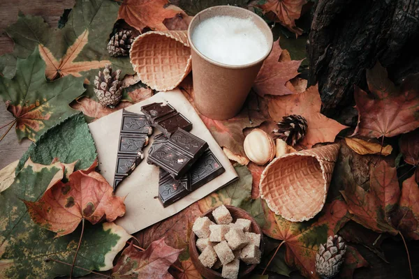 various sweets on leaves in autumn park