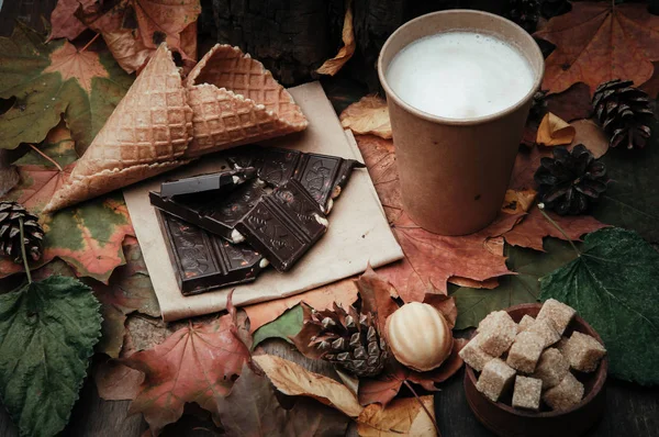 various sweets on leaves in autumn park