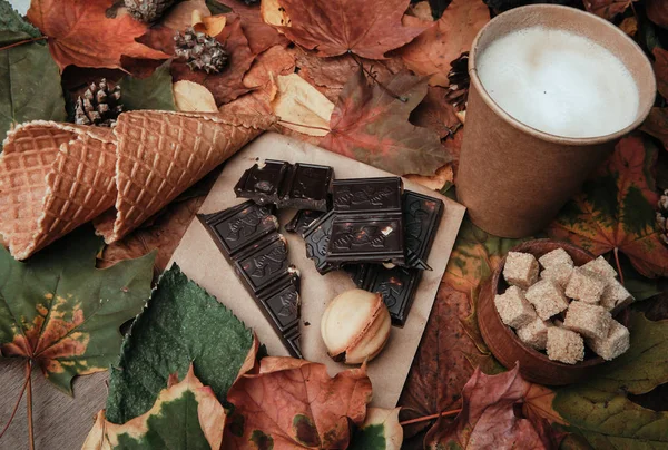 various sweets on leaves in autumn park