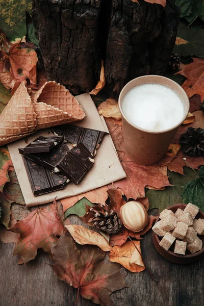 various sweets on leaves in autumn park