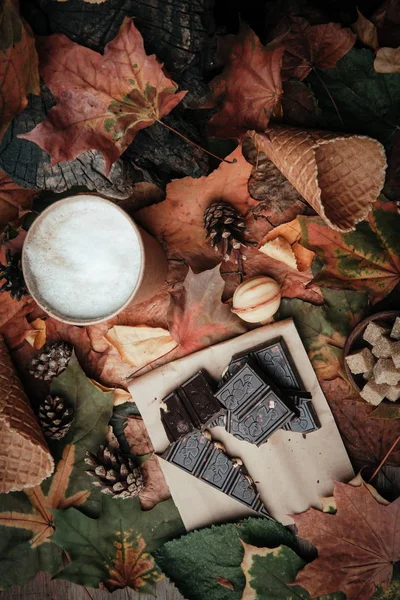 various sweets on leaves in autumn park