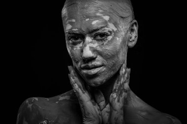 women painted with make-up and paints