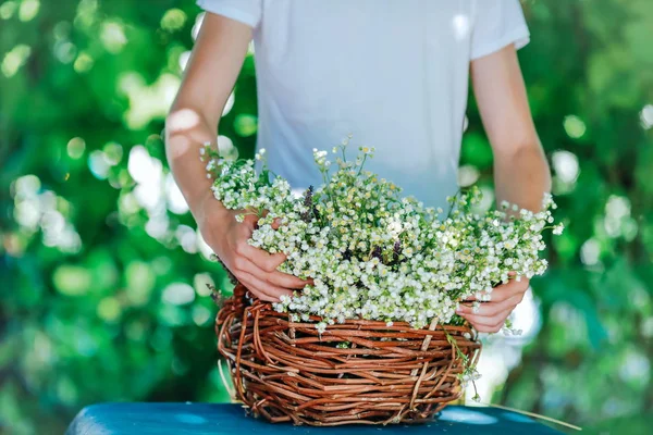 beautiful wildflowers gathered in a basket of vines