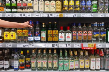 GERMANY - AUGUST 2018: Display of various German grain brandy in a REWE supermarket. clipart