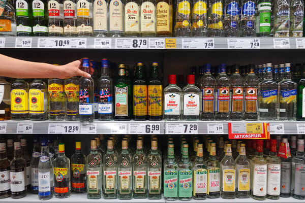 GERMANY - AUGUST 2018: Display of various German grain brandy in a REWE supermarket.