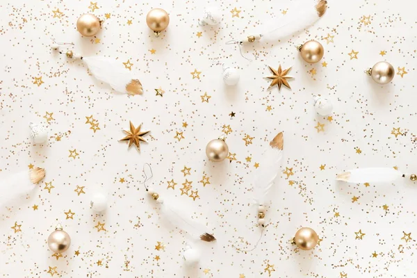 Christmas background pattern from gold and white Christmas decorations . Xmas composition of New Year\'s Christmas balls. Winter holiday concept.Flat lay. Top view. Copy space