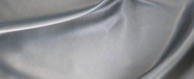 Kumaş ipek saten doku arka plan silber renk banner. Lüks kumaş dalgasının arka plan.