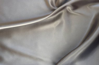 Kumaş ipek saten doku arka plan silber rengi. Lüks kumaş dalgasının arka plan.