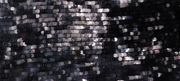 Banner sequin fabric texture background. Black color fabric, festive background