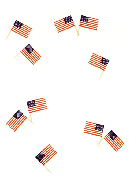 top view of american flagpoles arranged on white background