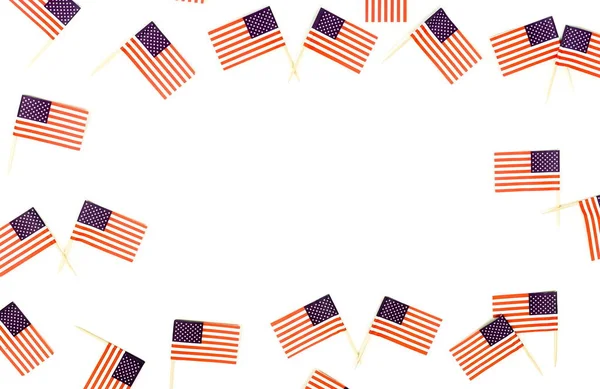 top view of american flagpoles arranged on white background