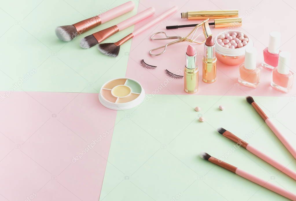 female beauty equipment on pink and green background