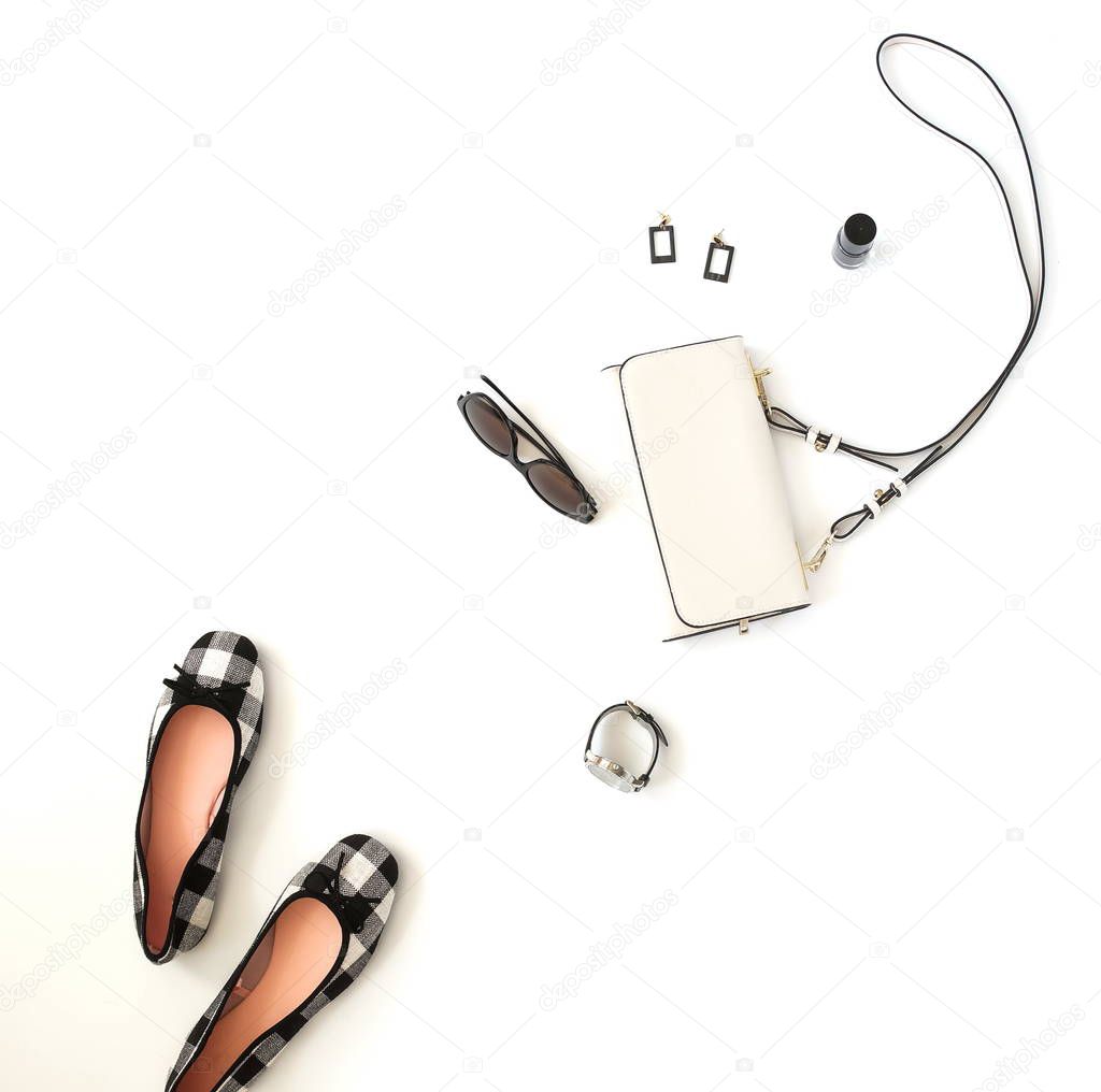 feminine accessories arranged on white tabletop