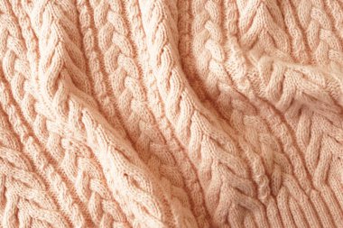 Pembe örme yün doku arka plan yakın. 