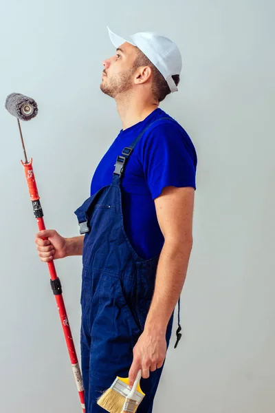 Man White Background Holds Paint Roller Brushesh — Stock Photo, Image