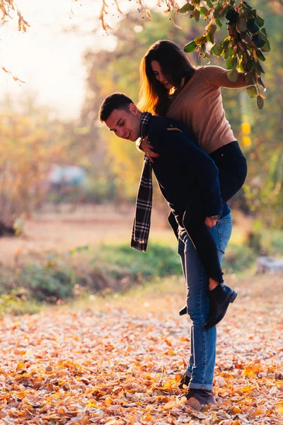 Girlfriend Top Her Boyfriends Back Pulling Leaves His Head — Stock Photo, Image