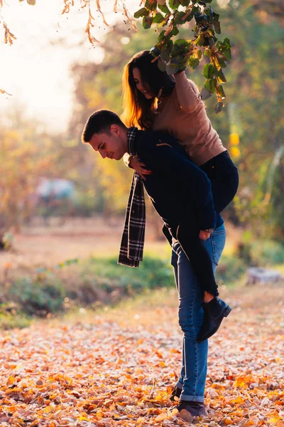 Girlfriend Top Her Boyfriends Back Pulling Leaves His Head — Stock Photo, Image