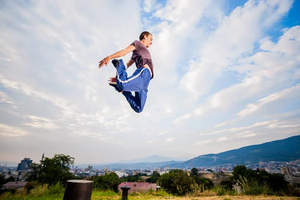 Caucasian Man Trains Parkour While Jump Blue Sky — Stock Photo, Image