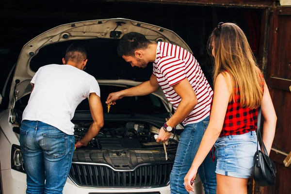Three Friends Checking Motor Oil Car Engine — Stock Photo, Image