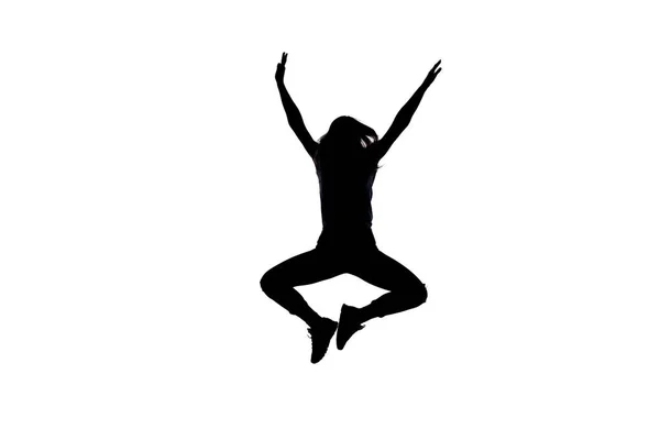 Silhouet van een meisje tijdens het springen — Stockfoto