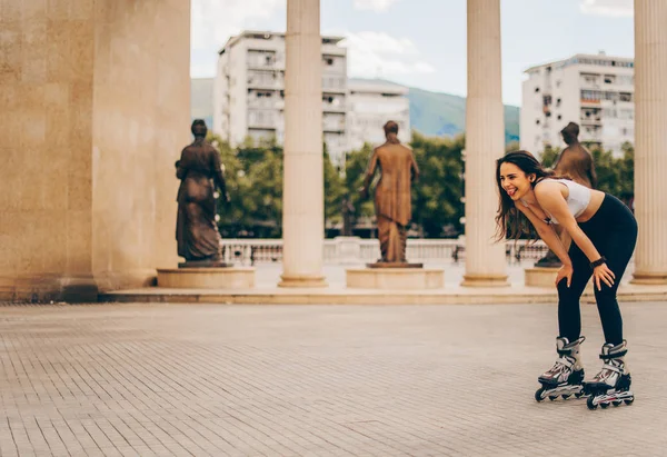 Young woman on roller skates outdoors in down town — Stock Photo, Image