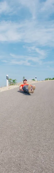 Urban cool longboarder preparing for a downhill ride(slide) doin