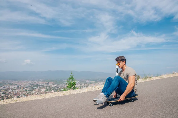 Urban cool longboarder preparing for a downhill ride(slide) doin