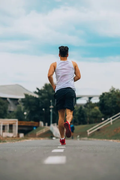 Handsome Young Man Sleeveless Running Jogging Trail — 图库照片