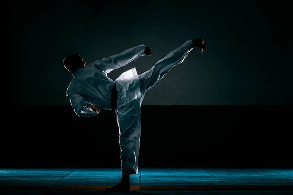 Man Kimono Black Belt Doing Forward Kick Black Background — Stock Photo, Image