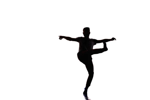 喜びの踊りを踊る若者の肖像画 白い背景に分離された画像 — ストック写真