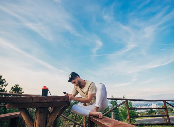 Young Handsome Hipster Man Concentrated While Reading His Smartphone — Stock Photo, Image