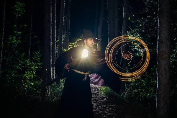 Wizard with a glowing staff casting a spell — ストック写真