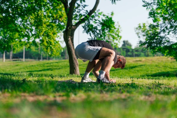 Sporty Young Man Practicing Crow Pose Bakasana Yoga Asana Outdoors — Stock Photo, Image