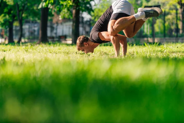 Sporty Young Man Practicing Crow Pose Bakasana Yoga Asana Outdoors — Stock Photo, Image