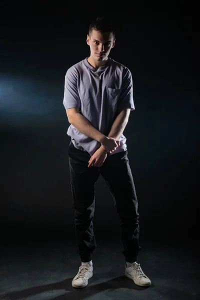 Handsome Young Man Wearing Gray Shirt Black Pants Poses Black — Stock Photo, Image