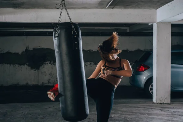 Young Sportswoman Doing High Kick Boxing Exercise Garage — Stock Photo, Image