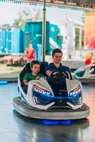 Happy Teenage Boys Driving Bumper Cars Festival — Stock Photo, Image