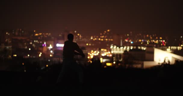 Silhouette Male Dancer While Dancing Night Hill Front City Lights — Stock Video