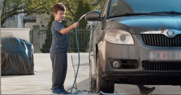 Young Boy Helping His Brother Washing Family Car Backyard Slow — Video Stock