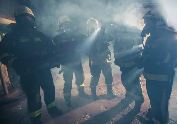 Group Firemen Gas Masks Standing Middle Chainsaw Smoke — Stock Photo, Image