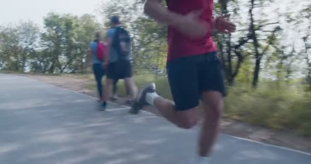 Man Running Slow Motion Mountain Road Camera Dolly Medium Shot — 비디오