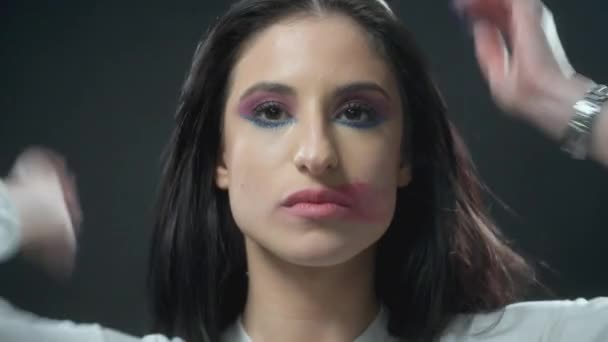 Girl Sitting Still While Lipstick Being Removed — Stock Video