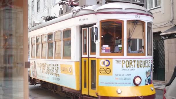 Lisbon street - 28 April: vintage Lisbon tram on city street, sunny day, 28 April, 2018, Lisbon, Portugal — Stock Video