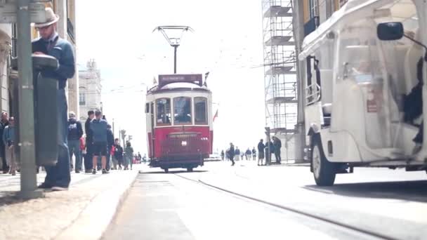 Lisbon street - 28 April: vintage Lisbon tram on city street, sunny day, 28 April, 2018, Lisbon, Portugal — Stock Video