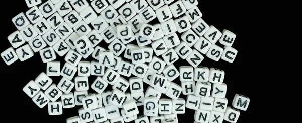 Randomly Scattered White Cubes Letters Isolated Black Background — Stock Photo, Image
