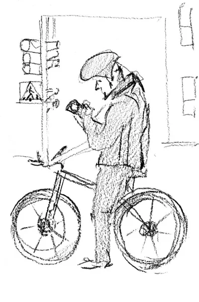 Pencil sketch. A male cyclist has stopped at a traffic light. He is looking at his mobile phone. — Stock Photo, Image